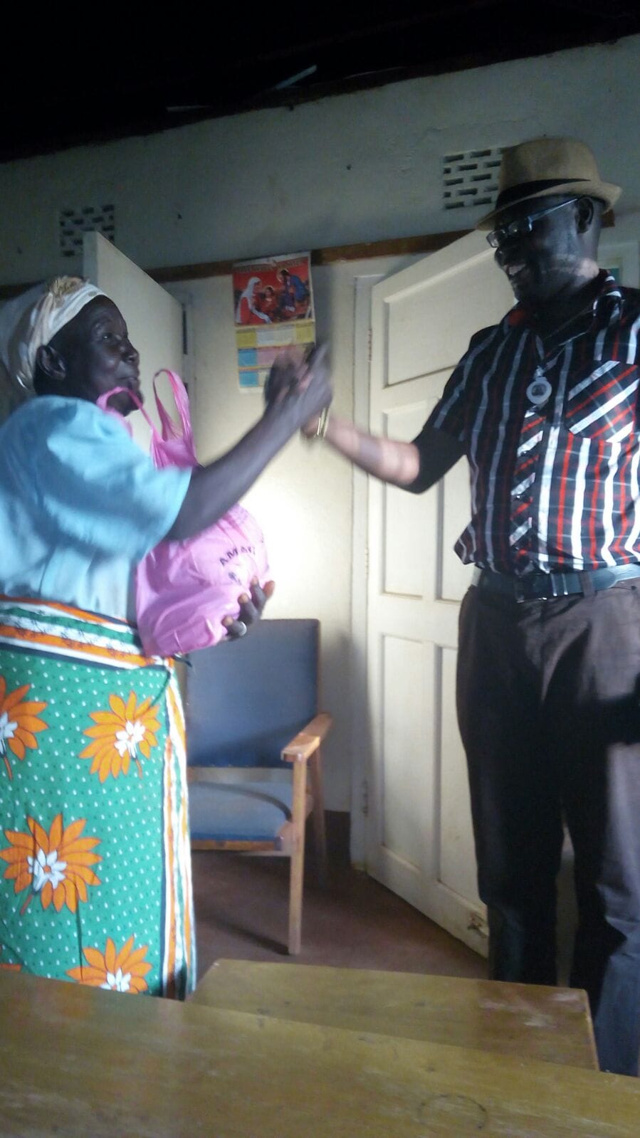 An older woman receiving compassionate support during a home visit