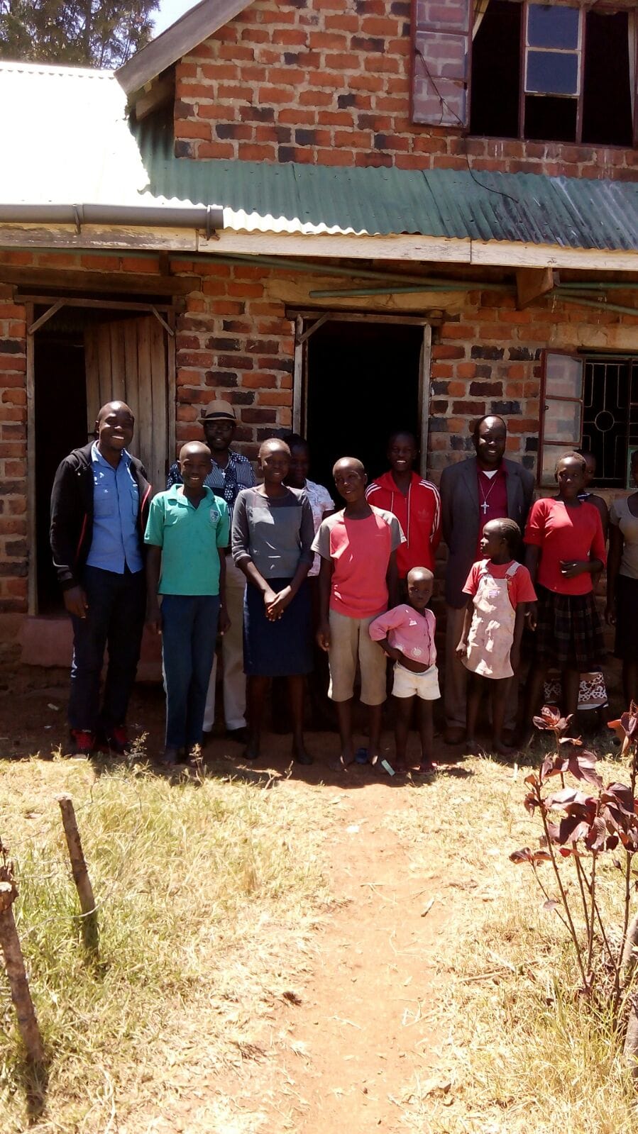 Children and community members together during a Foundation visit