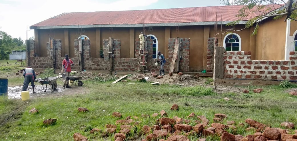 Construction team working on a church boundary