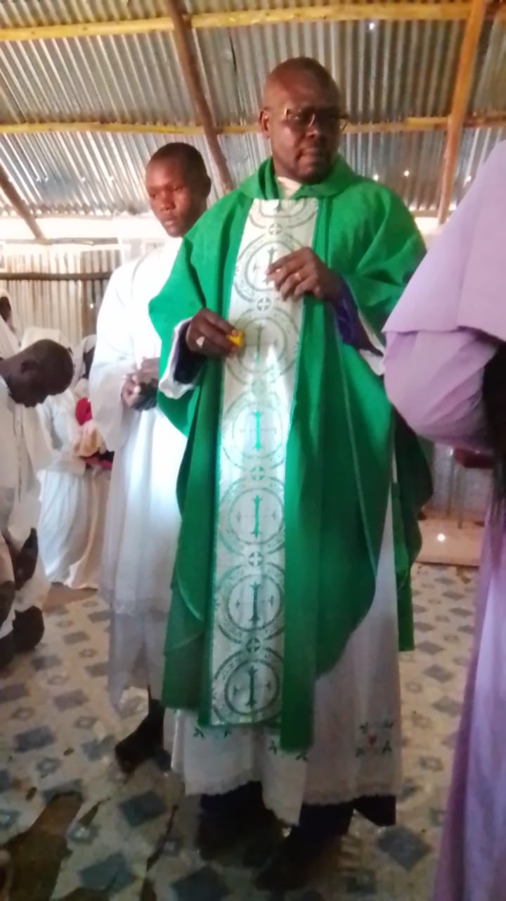 Rev. Father Willis Ondiek serving during a church ceremony